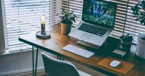 Person setting up as self-employed on a laptop, ready to register with HMRC