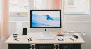 Self-employed person working from home at a tidy home office desk