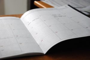 Monthly paper calendar used to plan tax year end deadlines for a sole trader